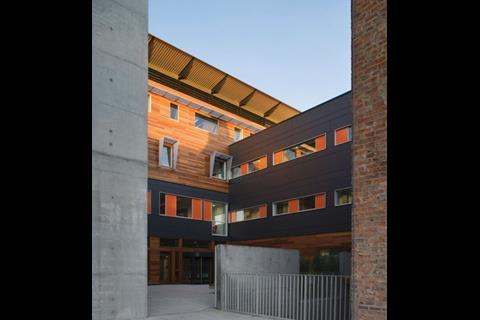 The compact central courtyard is bounded by modern lightweight facades